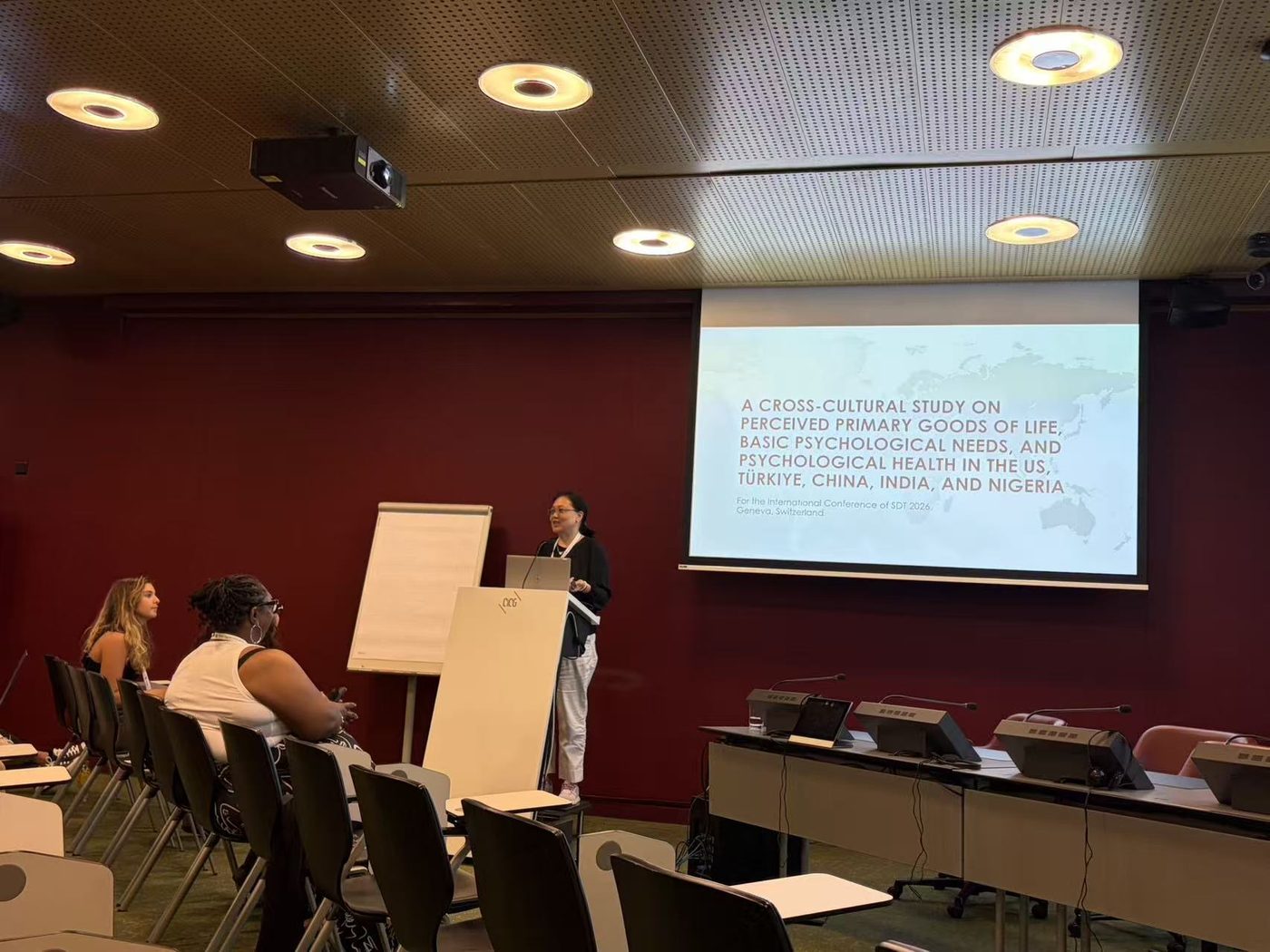 Zheni Wang opening her paper session at SDT 2026 in Geneva